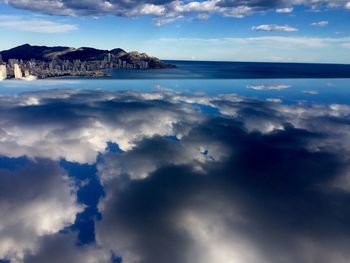 Scenic view of sea against cloudy sky