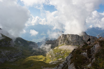 Scenic view of waterfall against sky