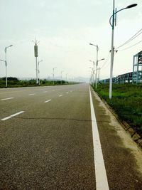 Empty road against sky