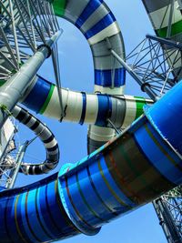 Low angle view of complex water slide against sky