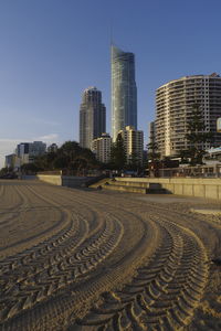 Modern buildings in city against clear sky