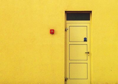 Close-up of yellow door