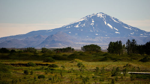 Scenic view of snowcapped mountains against sky