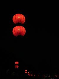 Low angle view of lantern against clear sky at night