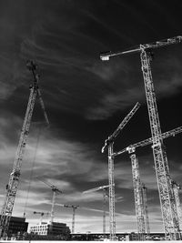 Low angle view of crane against sky