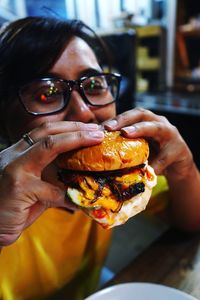 Girl eating burger