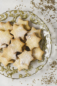 Homemade of star shapes baked butter cookies. top view.