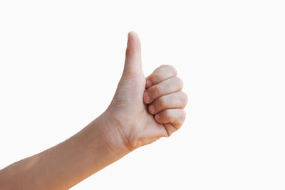 Close-up of human hand against white background