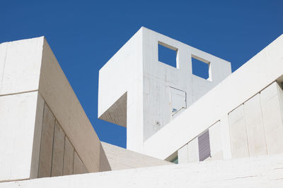 Low angle view of building against clear blue sky