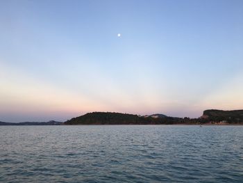 Scenic view of sea against sky at sunset