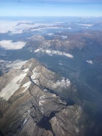 Aerial view of rocky mountains against sky