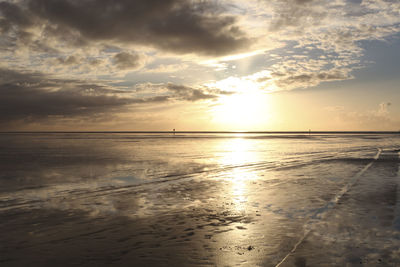 Scenic view of calm sea at sunset