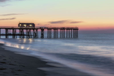 Scenic view of sea against sky at sunset