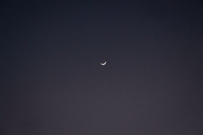 Low angle view of moon against sky at night