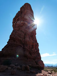 Low angle view of rock formation against sky