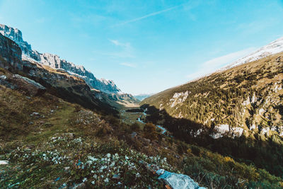 Scenic view of mountains against blue sky