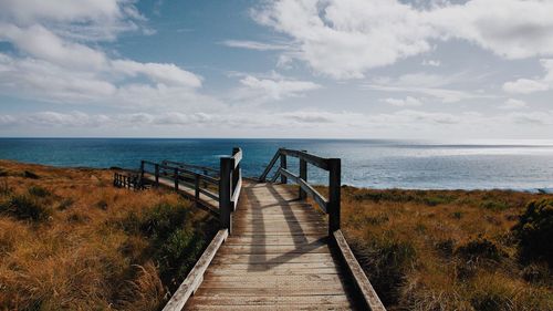 Pier over sea against sky