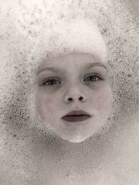 Close-up portrait of wet girl in bathroom
