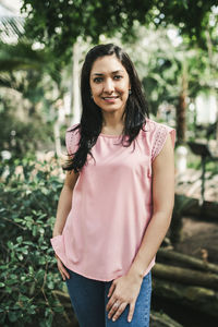 Corporate portrait of a beautiful agronomical engineer in a greenhouse