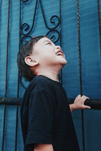 Low angle view of girl looking at playground