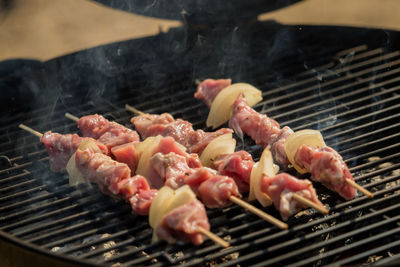 Close-up of meat on barbecue grill