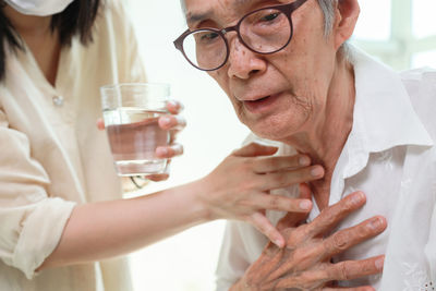 Midsection of woman holding hands