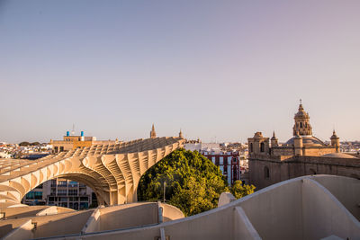 Buildings in seville against clear sky