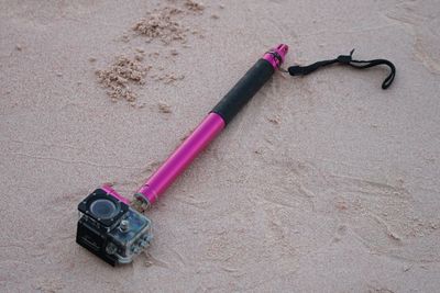 High angle view of wearable camera on sandy beach