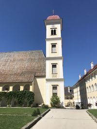 Low angle view of building against clear blue sky