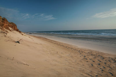 Scenic view of beach against sky