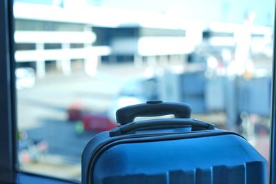 Close-up of luggage against window