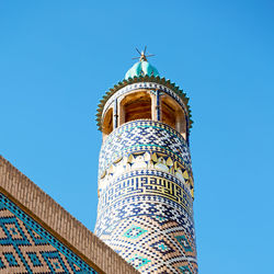 Low angle view of building against blue sky