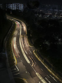 High angle view of light trails on road at night