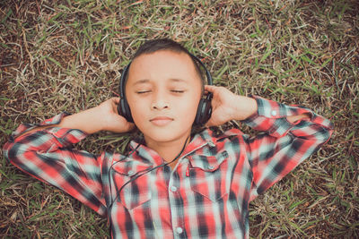 Portrait of girl lying on grass