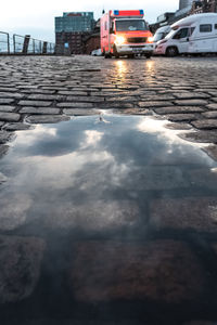 Puddle on road in city