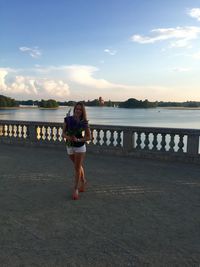 Woman standing against river at observation point