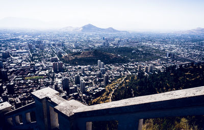 High angle view of city buildings against clear sky