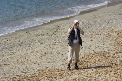 Man photographing at beach