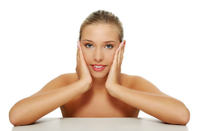 Portrait of woman against white background