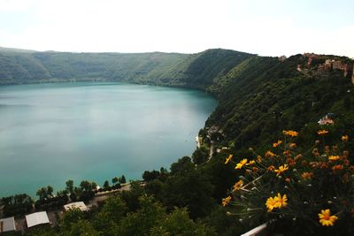 Scenic view of lake and mountains against sky