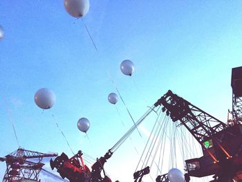 Low angle view of hot air balloon against clear blue sky