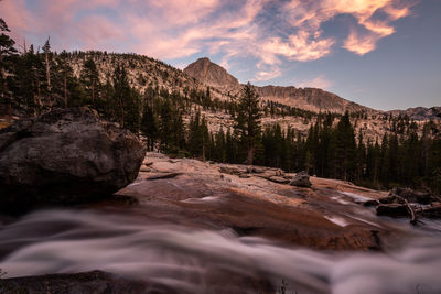 Scenic view of rocks against sky during sunset