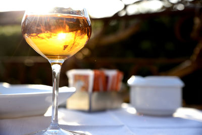 Close-up of wineglass on table