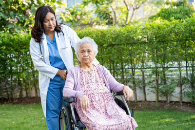 Side view of young woman using mobile phone