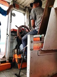 Low angle view of man working at construction site