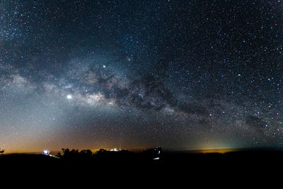 Scenic view of star field against sky at night