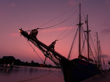 Silhouette of sailboat against sky during sunset