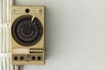 Close-up of telephone booth on wall