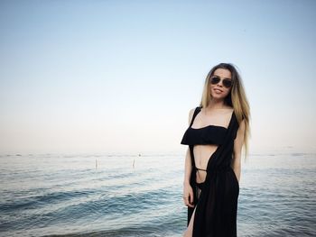 Portrait of young woman in sea