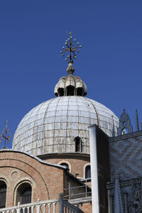 Low angle view of building against blue sky